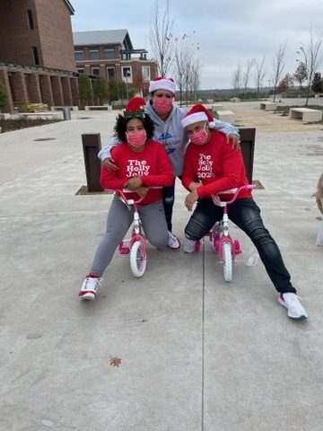 Volunteers having fun on the little bikes