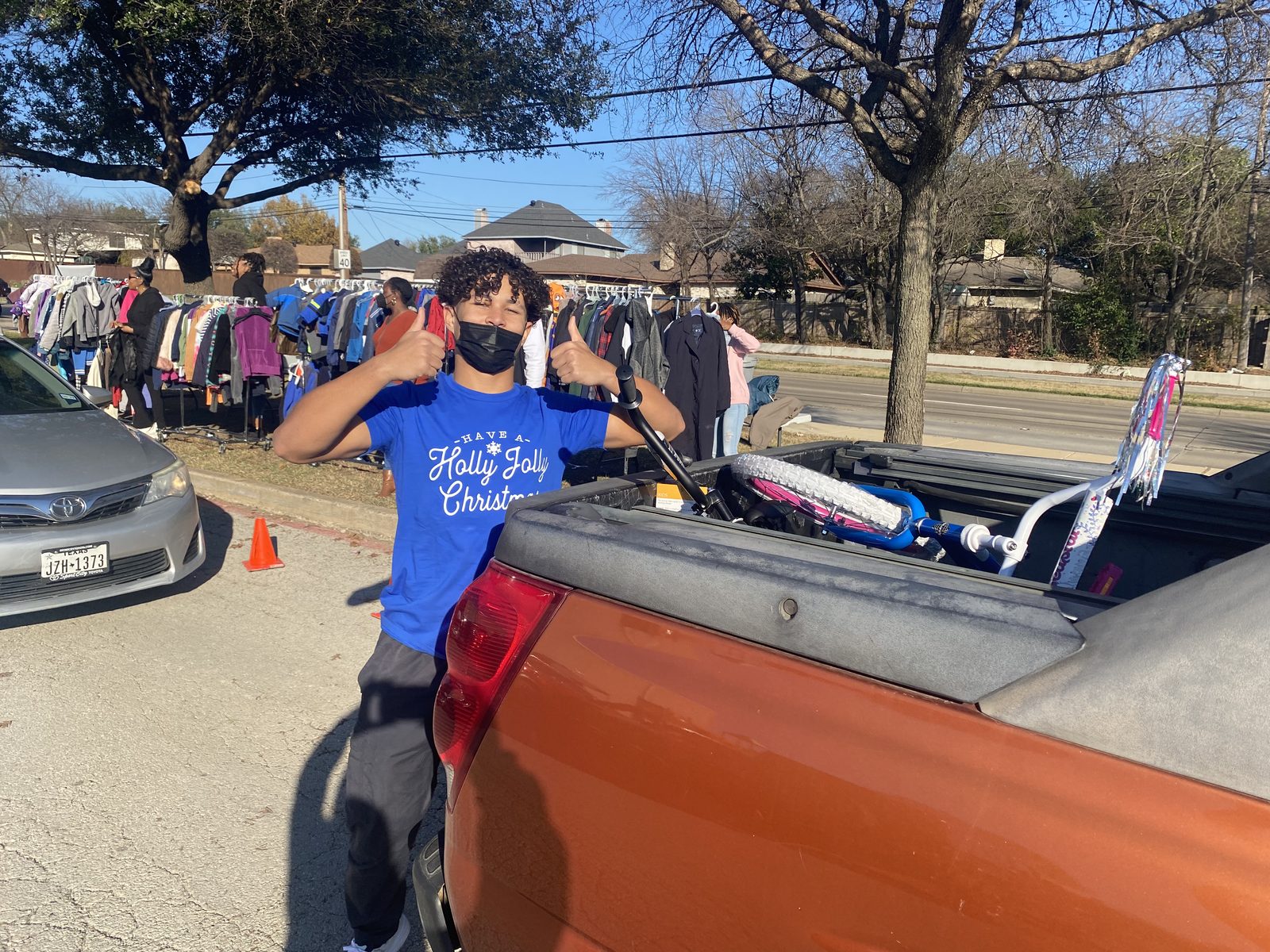 A young attendee with bikes in a truck bed