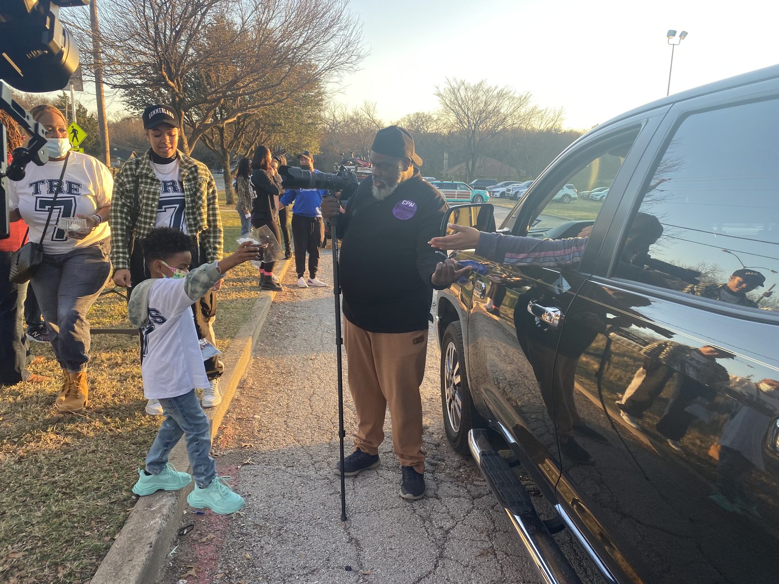 Families and volunteers at pick-up