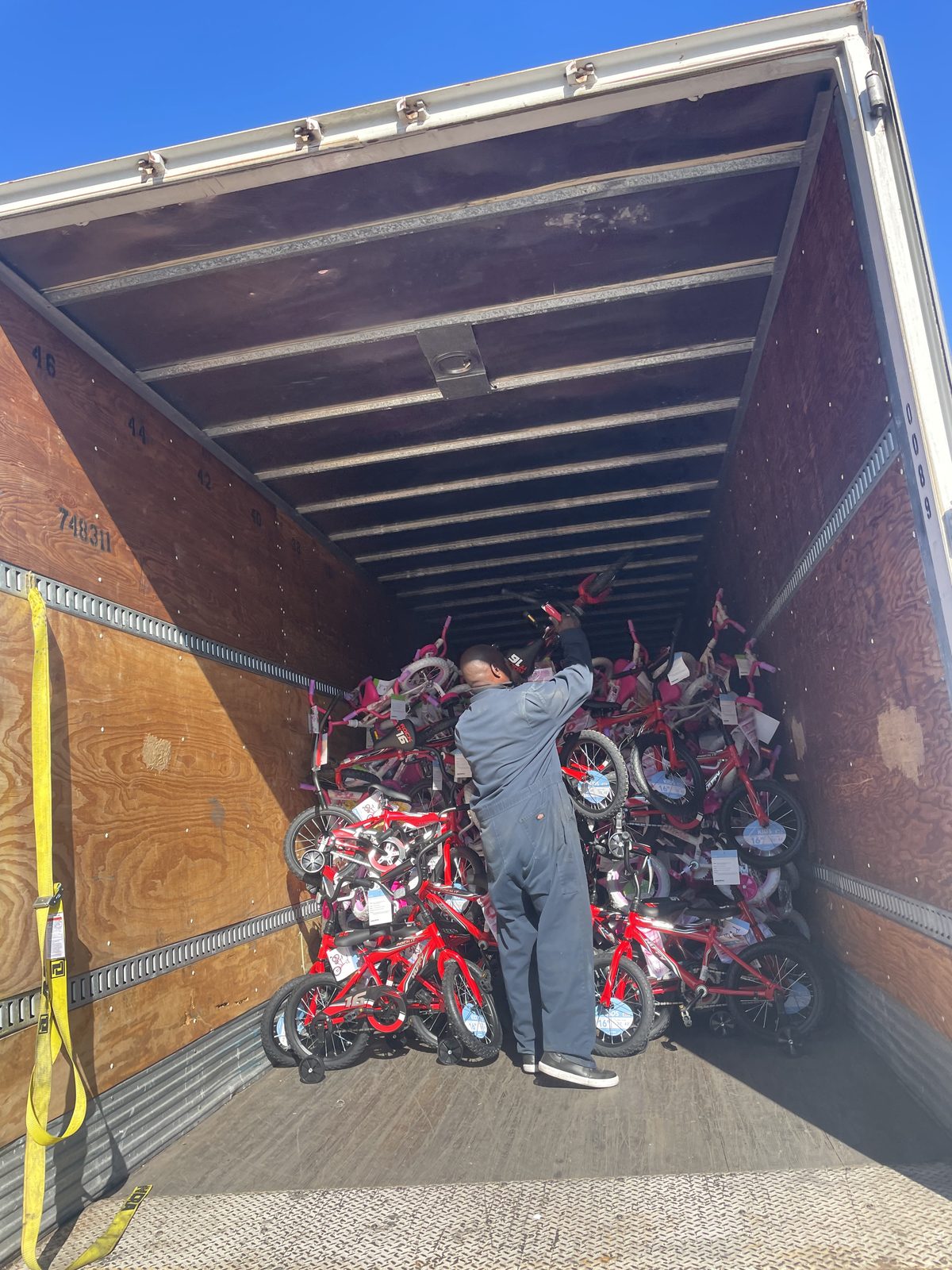 A volunteer with a truck full of gifts