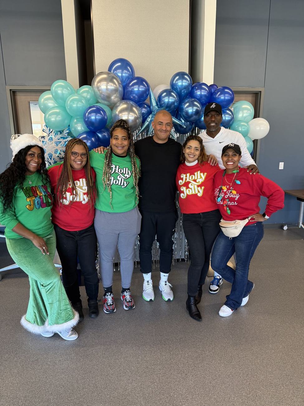 The Holly Jolly volunteer team ready to welcome families